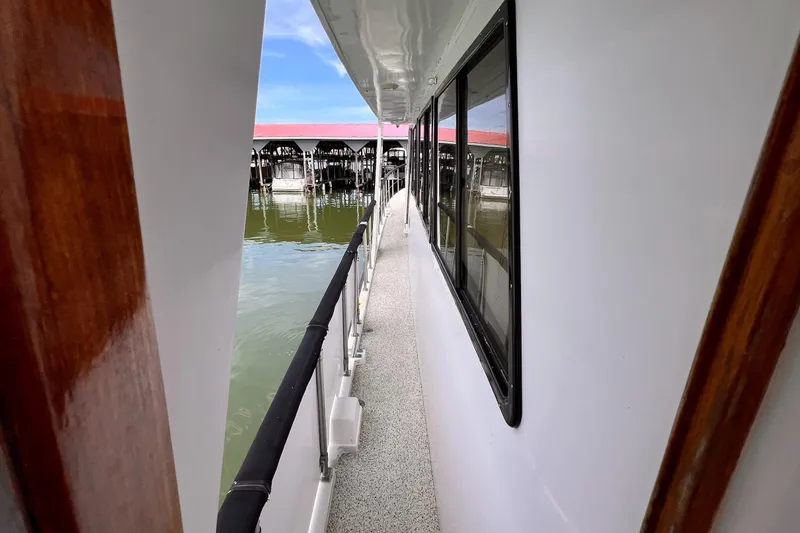 Slide: The Image of Side deck view of 1985 Hartman-Palmer 60 Flush Deck Motor Yacht at marina. - 15
