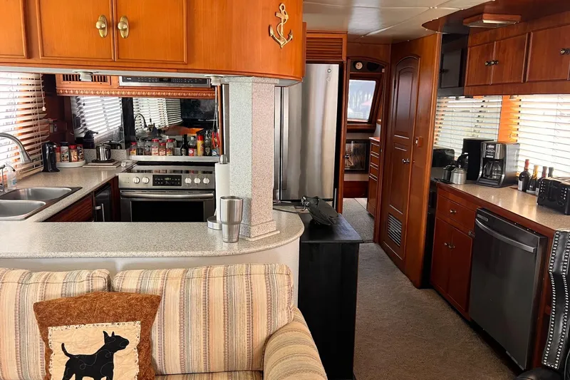 Slide: The Image of Interior of 1985 Hartman-Palmer 60 Flush Deck Motor Yacht with modern kitchen amenities. - 21