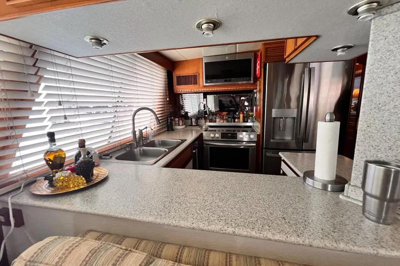 Slide: The Image of Luxurious kitchen interior of 1985 Hartman-Palmer 60 Flush Deck Motor Yacht. - 22