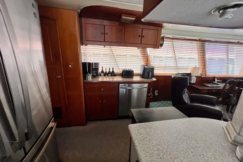 Slide: The Image of Interior of 1985 Hartman-Palmer yacht with kitchen and seating area. - 25