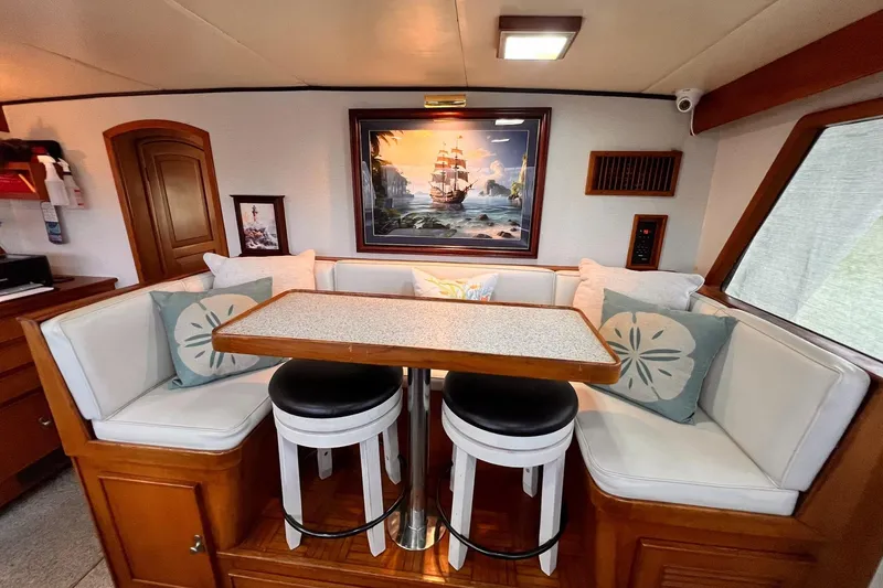 Slide: The Image of Interior of 1985 Hartman-Palmer yacht with cozy dining area and nautical decor. - 29