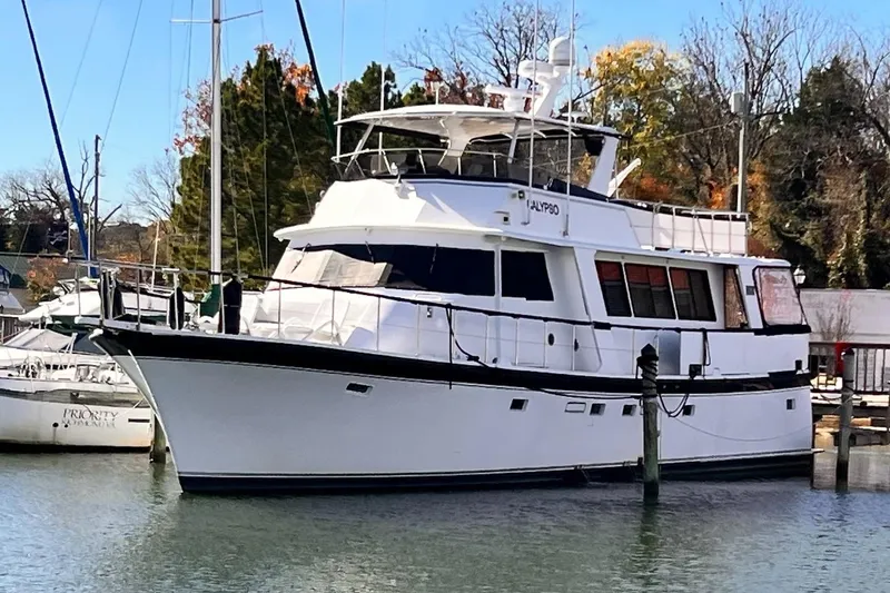 Slide: The Image of 1985 Hartman-Palmer 60 Flush Deck Motor Yacht docked in a marina. - 3