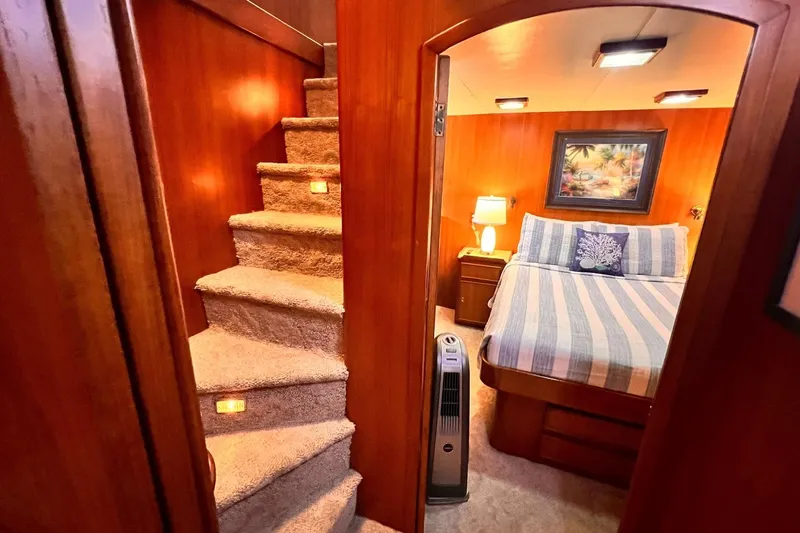 Slide: The Image of Cozy bedroom in 1985 Hartman-Palmer 60 Flush Deck Motor Yacht with carpeted stairs. - 35