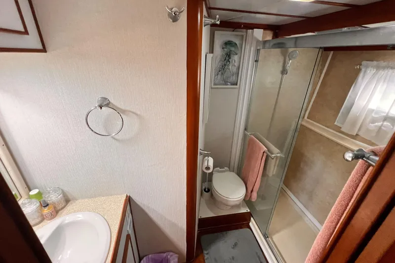Slide: The Image of Bathroom interior of 1985 Hartman-Palmer 60 Flush Deck Motor Yacht, featuring shower and sink. - 39