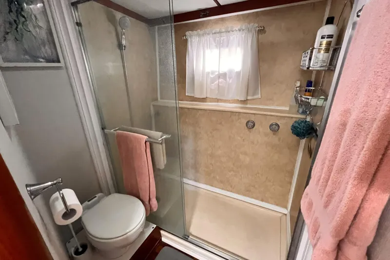 Slide: The Image of Bathroom interior of 1985 Hartman-Palmer 60 Flush Deck Motor Yacht, featuring shower and toilet. - 40
