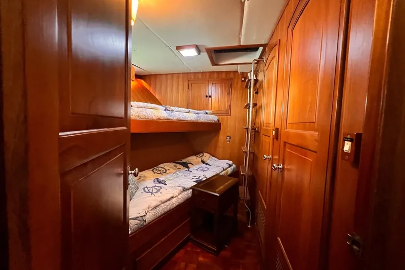 Slide: The Image of Cozy wooden cabin with bunk beds on 1985 Hartman-Palmer 60 Flush Deck Motor Yacht. - 54