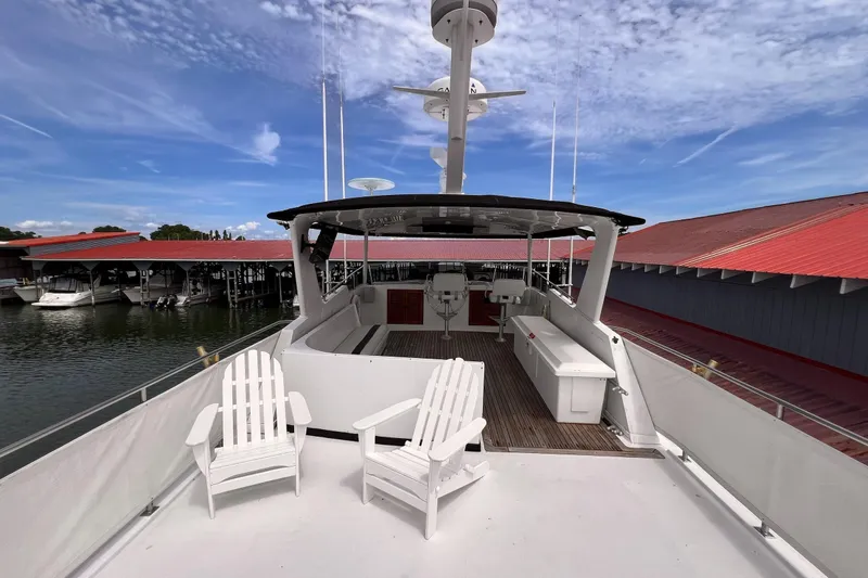 Slide: The Image of 1985 Hartman-Palmer 60 Flush Deck Motor Yacht with spacious deck and seating area. - 7