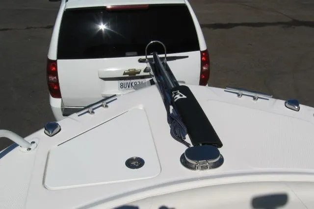 Slide: The Image of Bow of 2024 Edgewater 208CC boat near white Chevrolet SUV. - 4