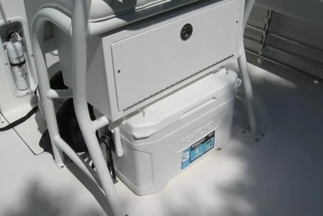 Slide: The Image of 2024 Edgewater 208CC boat interior with storage compartment and cooler. - 6