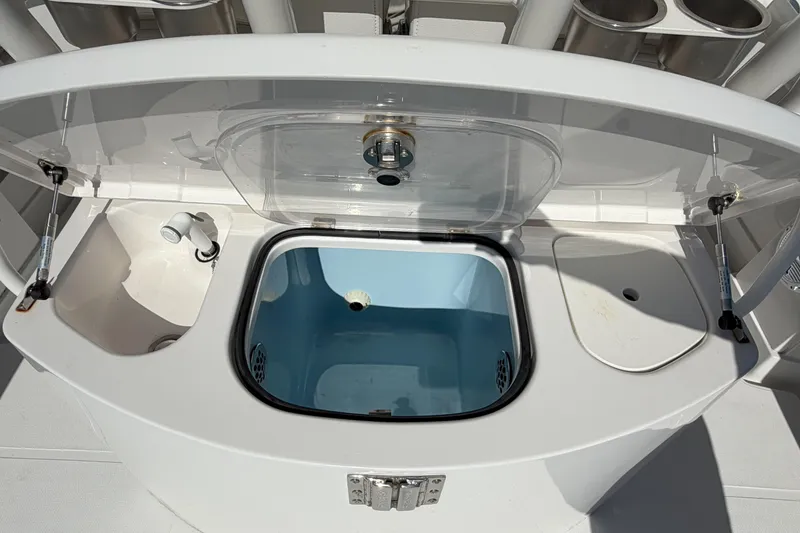 Slide: The Image of Livewell and sink on a 2018 Jupiter 38 FS boat, featuring a clean, modern design. - 18