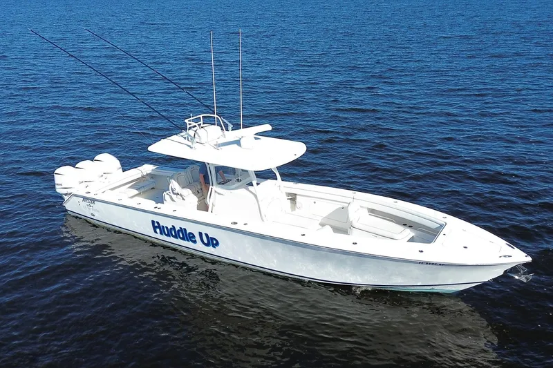 Slide: The Image of 2018 Jupiter 38 FS boat on open water, featuring sleek design and multiple engines. - 3