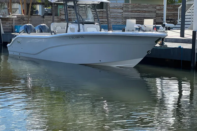 Slide: The Image of 2023 Sea Fox 268 Commander boat docked in calm waters. - 5