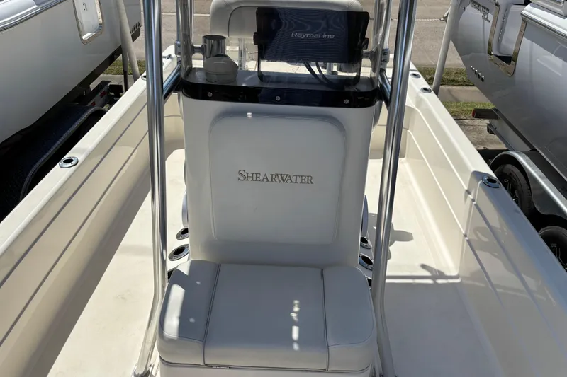 Slide: The Image of 2006 Shearwater Boatworks 2400Z interior with console and seating. - 10