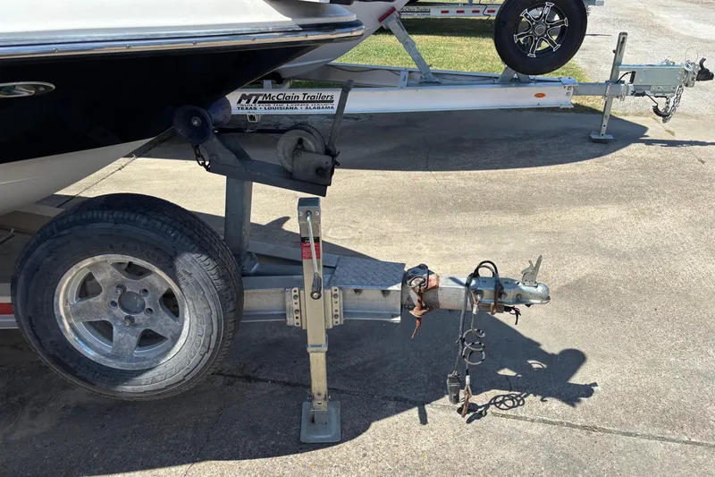 Slide: The Image of Trailer hitch and wheel of a 2006 Shearwater Boatworks 2400Z on concrete. - 5