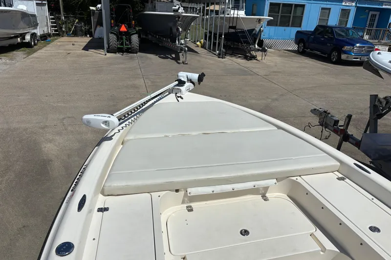 Slide: The Image of 2006 Shearwater Boatworks 2400Z on trailer, featuring a trolling motor and spacious deck. - 9