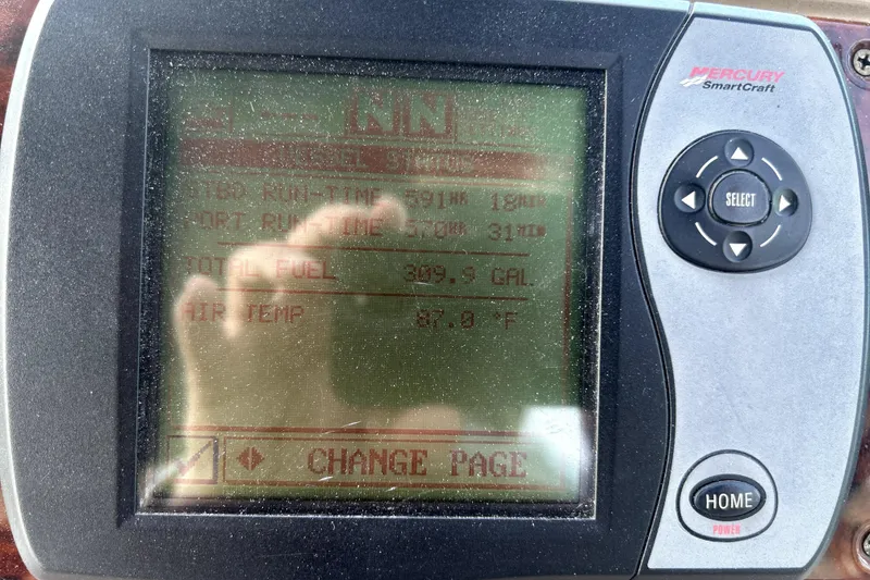 Slide: The Image of Mercury SmartCraft display on 2004 Wellcraft 47 Excalibur showing engine data and fuel levels. - 18