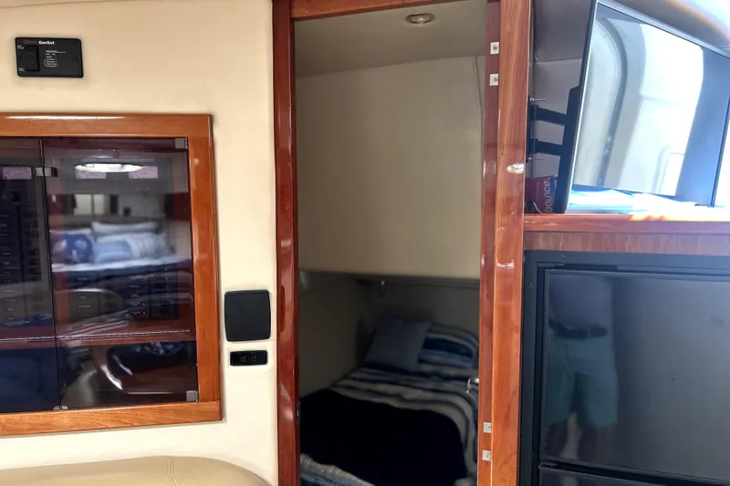 Slide: The Image of Interior of 2004 Wellcraft 47 Excalibur yacht with cozy cabin and modern amenities. - 22