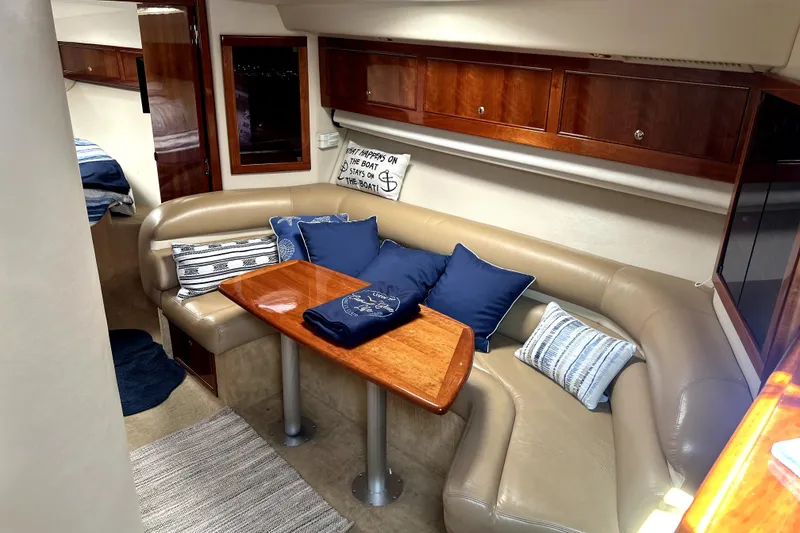 Slide: The Image of Luxurious interior of 2004 Wellcraft 47 Excalibur with cozy seating and elegant wood finishes. - 25