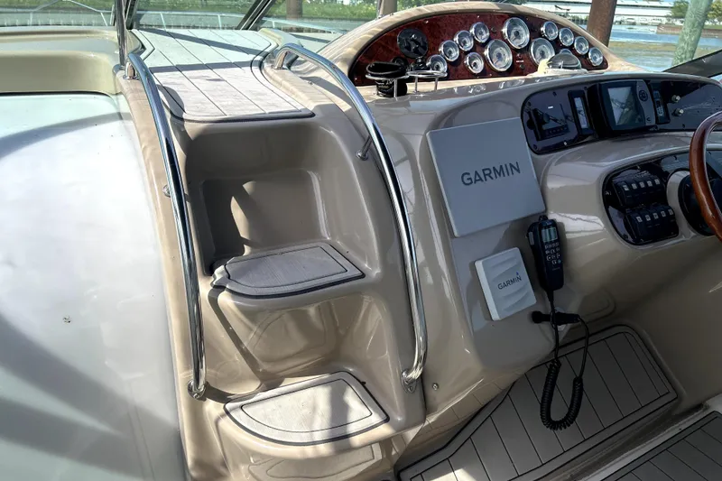 Slide: The Image of 2004 Wellcraft 47 Excalibur helm with Garmin navigation system and control panel. - 26