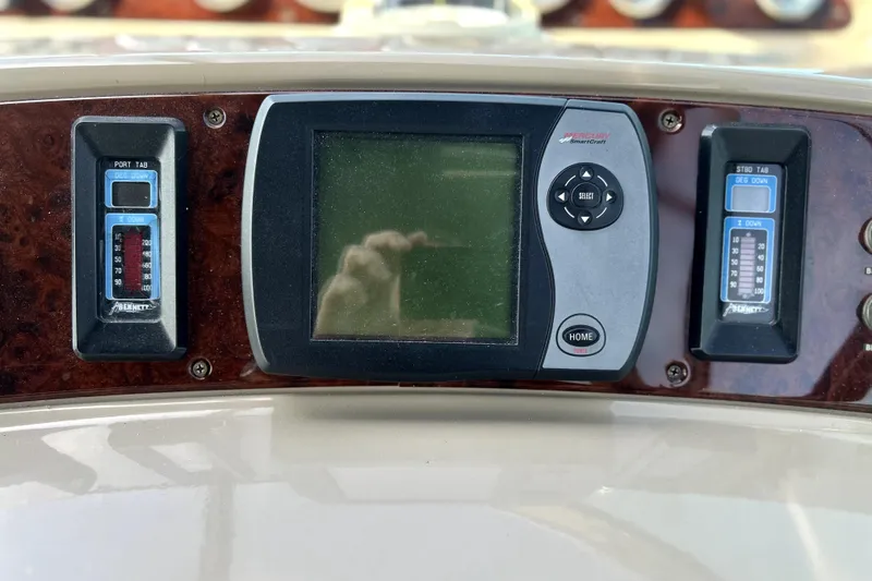 Slide: The Image of Control panel of a 2004 Wellcraft 47 Excalibur boat with digital display. - 27