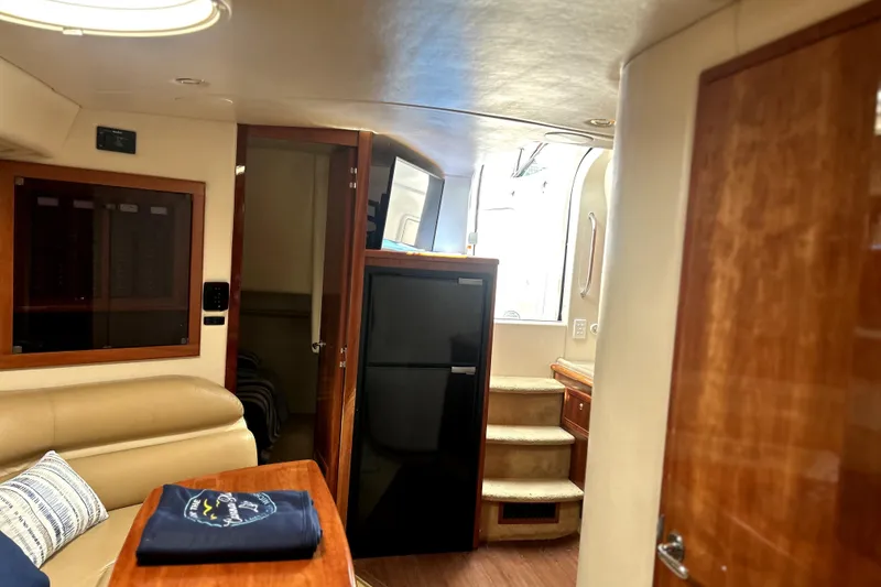 Slide: The Image of Interior of 2004 Wellcraft 47 Excalibur yacht with seating, fridge, and stairs. - 31