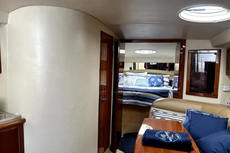 Slide: The Image of Interior of 2004 Wellcraft 47 Excalibur yacht, featuring cozy cabin and stylish decor. - 35