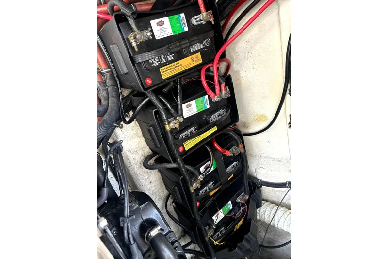 Slide: The Image of Battery setup in a 2004 Wellcraft 47 Excalibur boat engine compartment. - 42