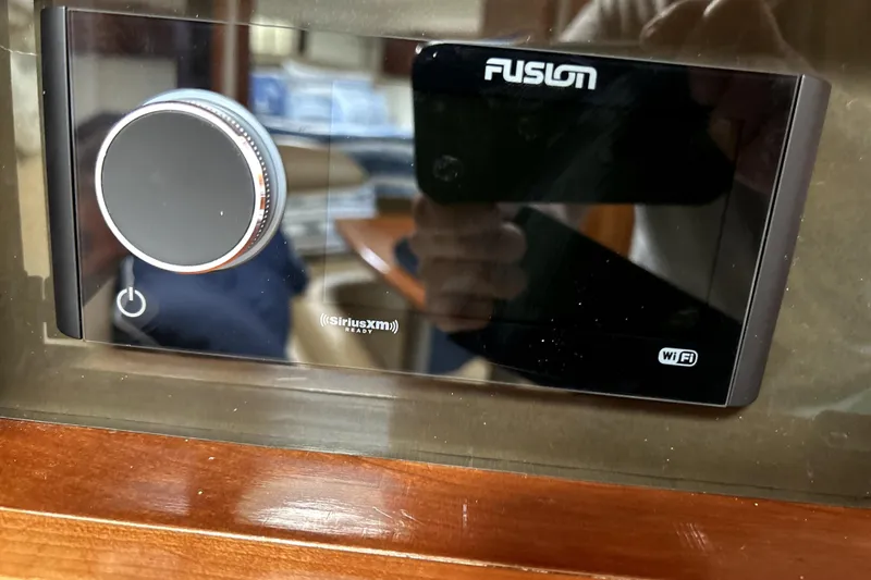 Slide: The Image of Fusion audio system with SiriusXM and WiFi in 2004 Wellcraft 47 Excalibur boat. - 43