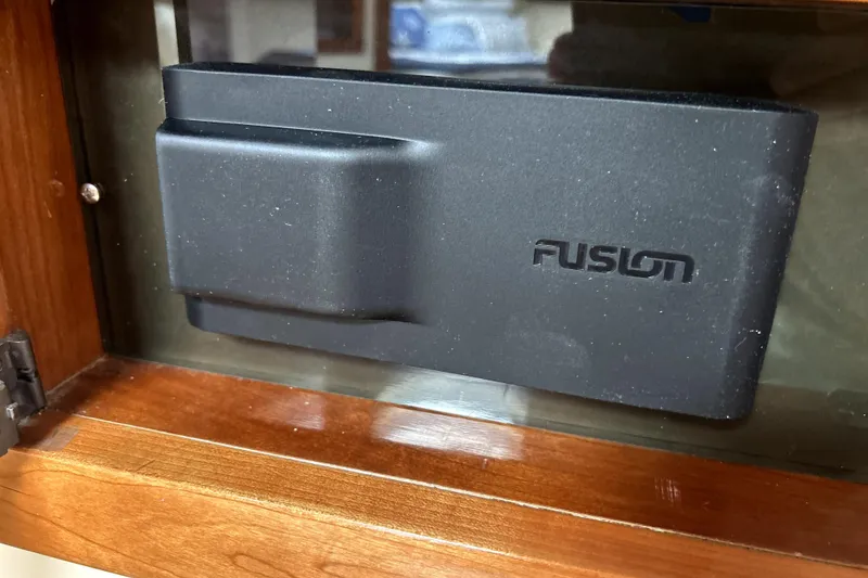Slide: The Image of Fusion audio device in a 2004 Wellcraft 47 Excalibur boat interior. - 44