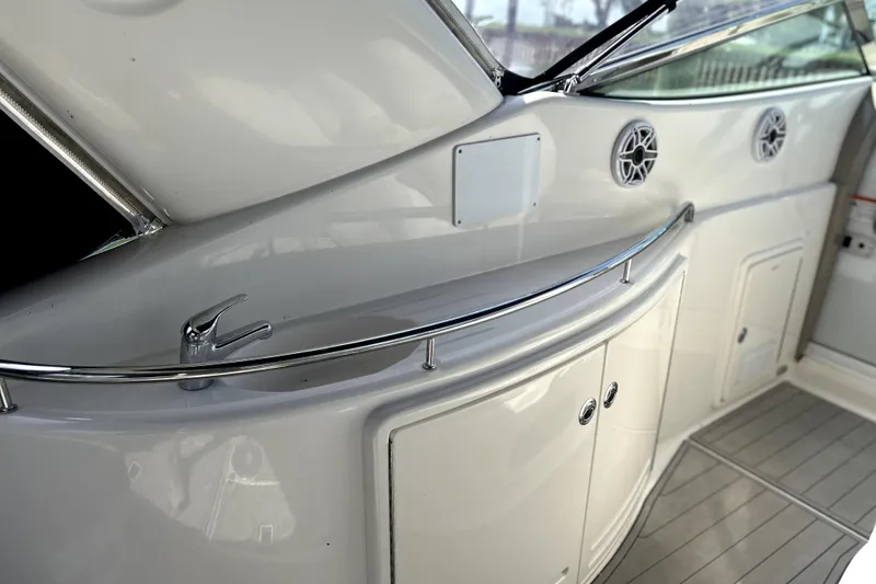 Slide: The Image of 2004 Wellcraft 47 Excalibur boat interior with sleek cabinetry and modern design elements. - 5