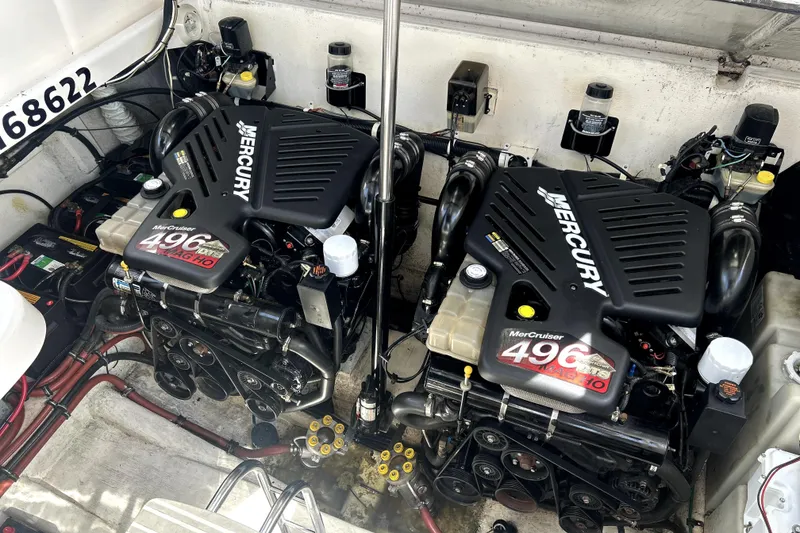 Slide: The Image of Twin Mercury MerCruiser 496 engines in a 2004 Wellcraft 47 Excalibur boat. - 50