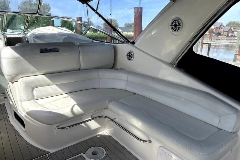 Slide: The Image of Luxurious white seating area on a 2004 Wellcraft 47 Excalibur boat. - 9