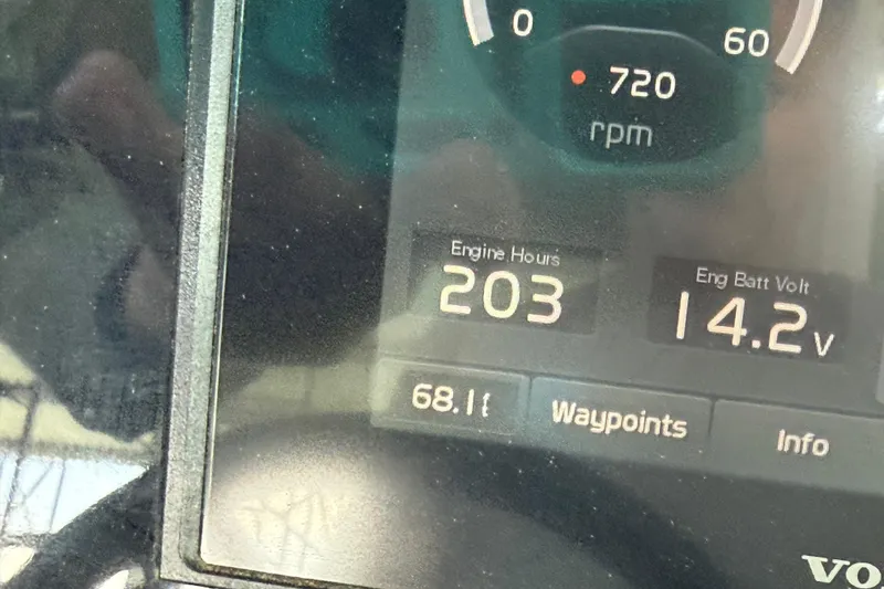 Slide: The Image of Dashboard of 2020 Regal LS4 Surf showing 203 engine hours and 14.2V battery voltage. - 11