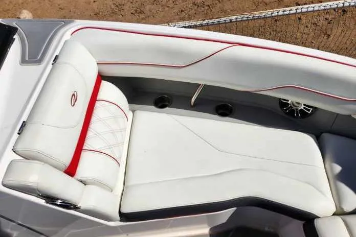 Slide: The Image of 2020 Regal LS4 Surf boat interior with white and red cushioned seating. - 12