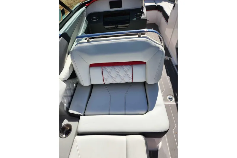 Slide: The Image of 2020 Regal LS4 Surf boat interior with white leather seating and red accents. - 16