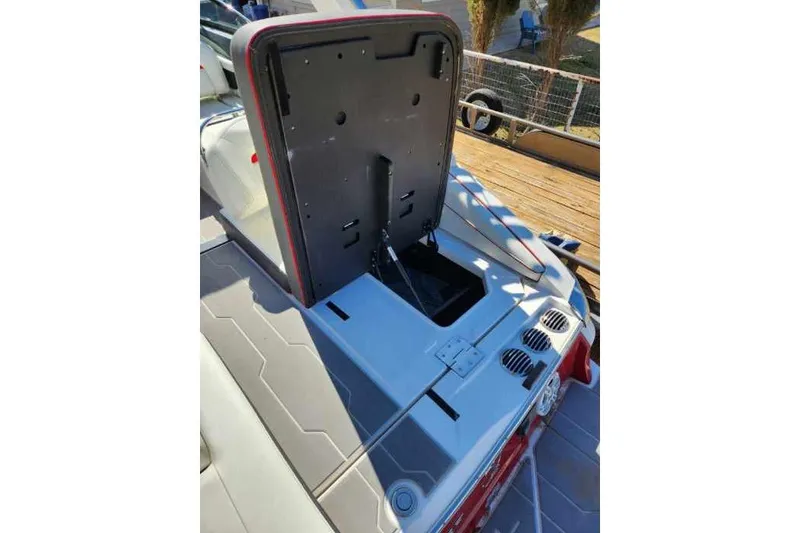 Slide: The Image of 2020 Regal LS4 Surf boat with open engine compartment, showcasing sleek design. - 24