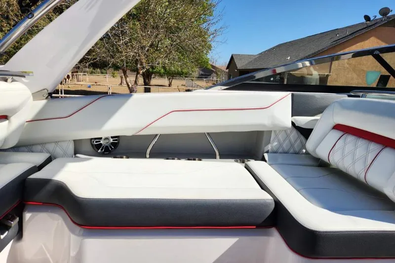 Slide: The Image of Interior of 2020 Regal LS4 Surf boat with white and red seating. - 28