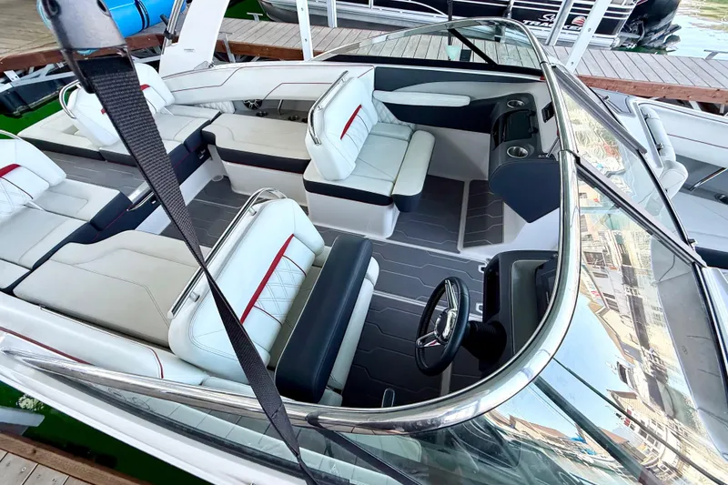 Slide: The Image of 2020 Regal LS4 Surf boat interior with white seating and modern dashboard. - 3