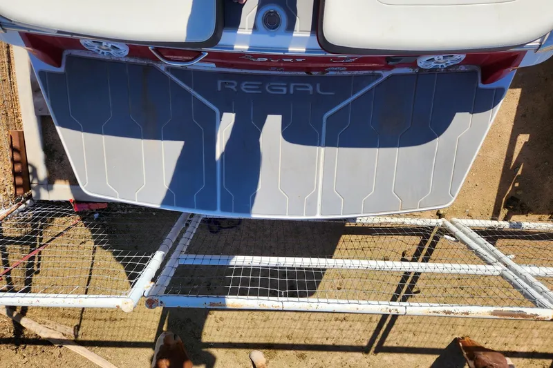 Slide: The Image of 2020 Regal LS4 Surf boat rear view with branded swim platform. - 30