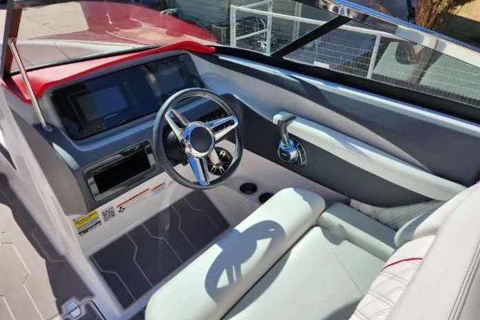 Slide: The Image of 2020 Regal LS4 Surf boat interior with modern dashboard and steering wheel. - 31