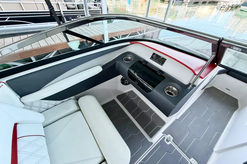 Slide: The Image of 2020 Regal LS4 Surf boat interior with sleek seating and modern dashboard design. - 8