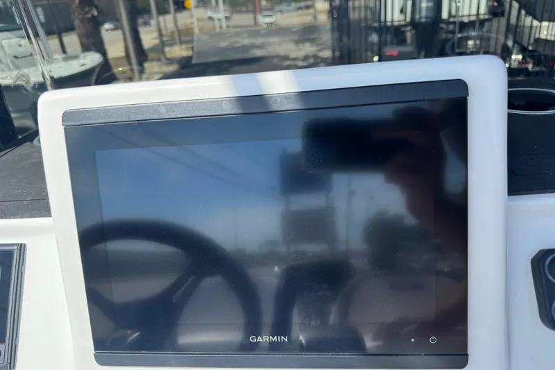 Slide: The Image of Garmin display on 2026 SCB R24 boat dashboard, reflecting outdoor scene. - 12