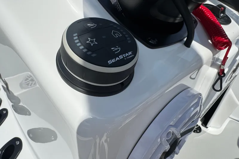 Slide: The Image of Control panel on 2026 SCB R24 boat with SeaStar system and safety lanyard. - 16