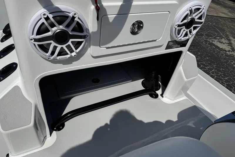 Slide: The Image of 2026 SCB R24 boat console with speakers and storage compartment. - 17