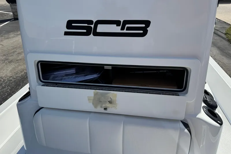Slide: The Image of 2026 SCB R24 boat console with storage compartment, featuring SCB logo. - 20