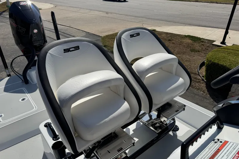Slide: The Image of 2026 SCB R24 boat with dual white seats and outboard motor. - 25