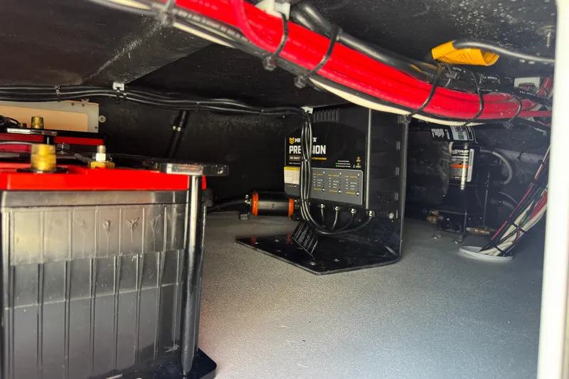 Slide: The Image of Battery compartment of 2026 SCB R24 with wiring and charger components. - 29