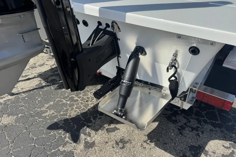 Slide: The Image of 2026 SCB R24 boat transom with hydraulic components and trailer hitch. - 3