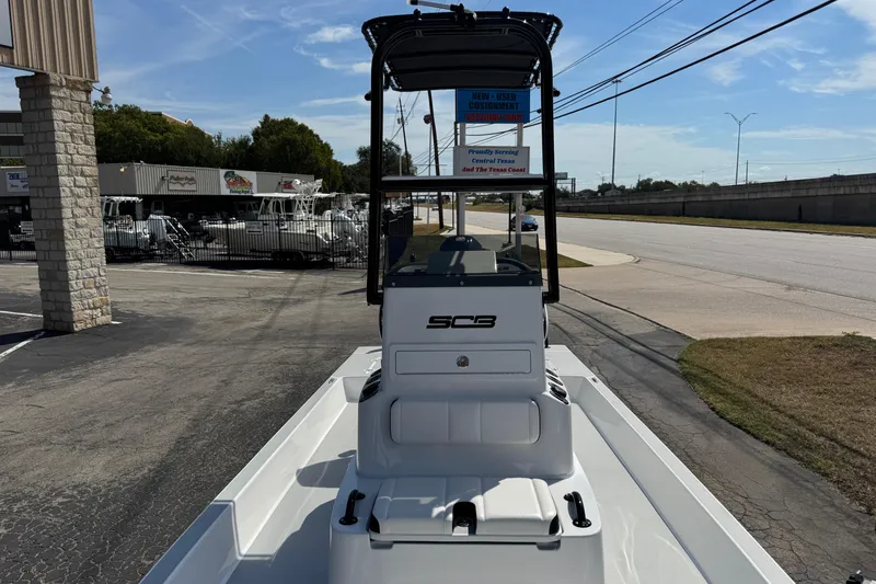 Slide: The Image of 2026 SCB R24 boat displayed outdoors at a dealership, showcasing sleek design and modern features. - 34