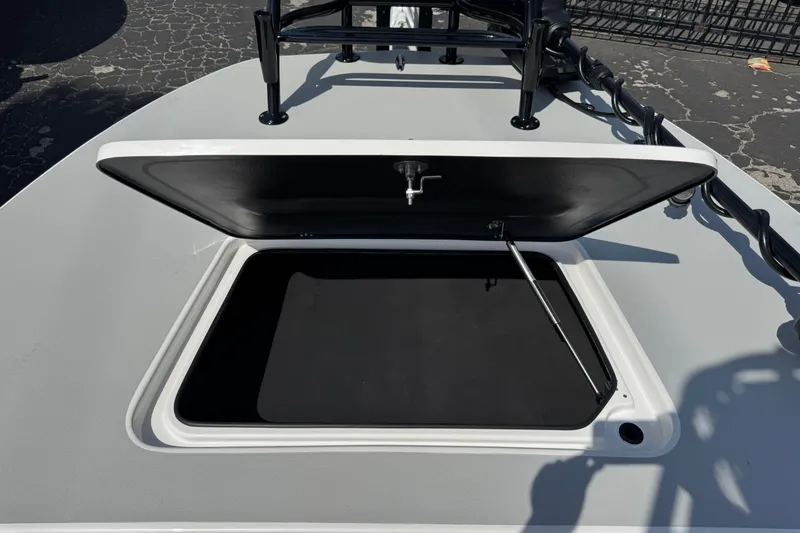 Slide: The Image of Open storage compartment on 2026 SCB R24 boat deck. - 36